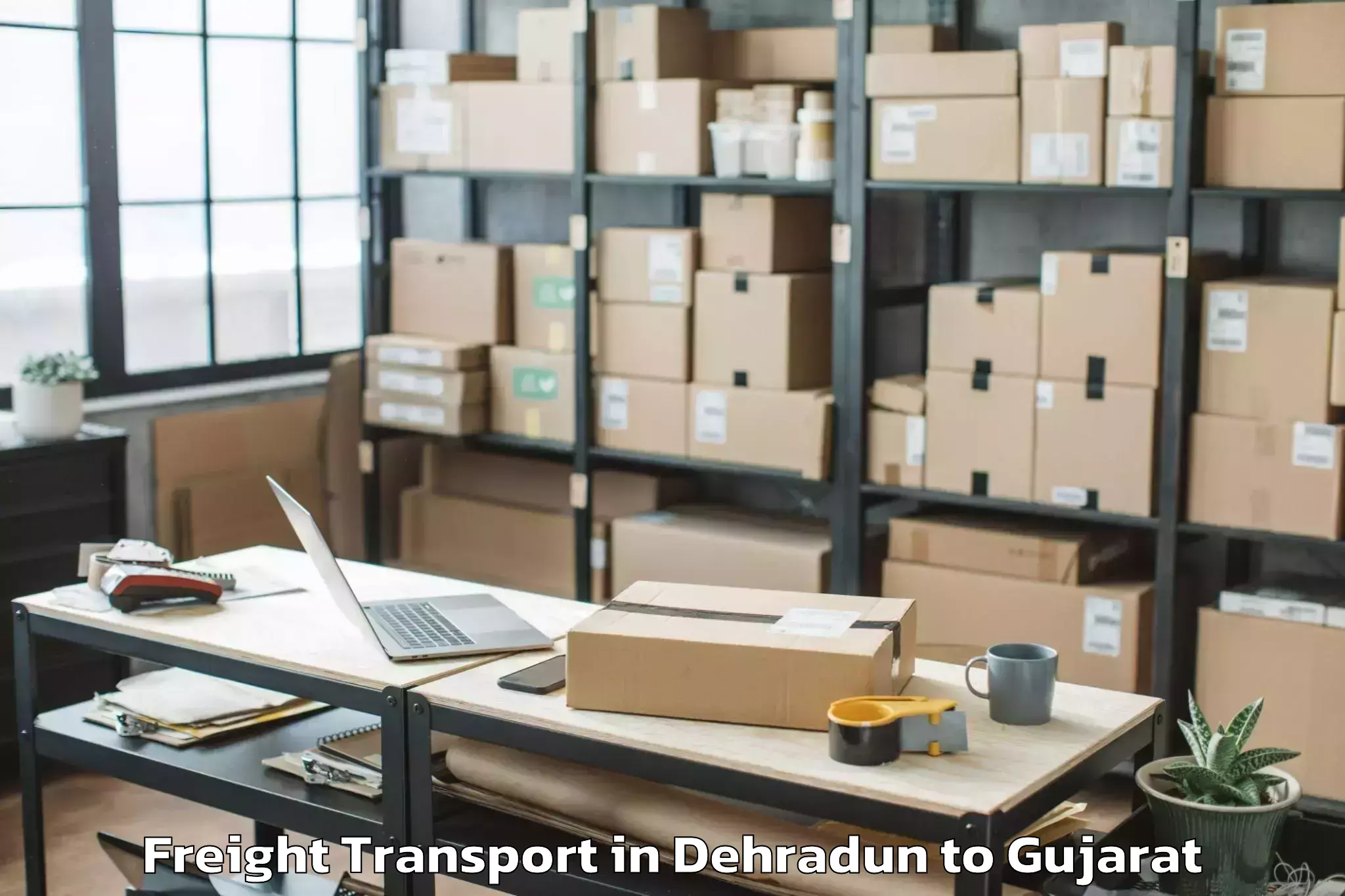 Book Dehradun to Vaghodia Ina Freight Transport